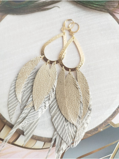 beige antique gold extra long leather feather earrings.