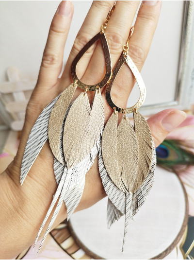 beige antique gold extra long leather feather earrings.