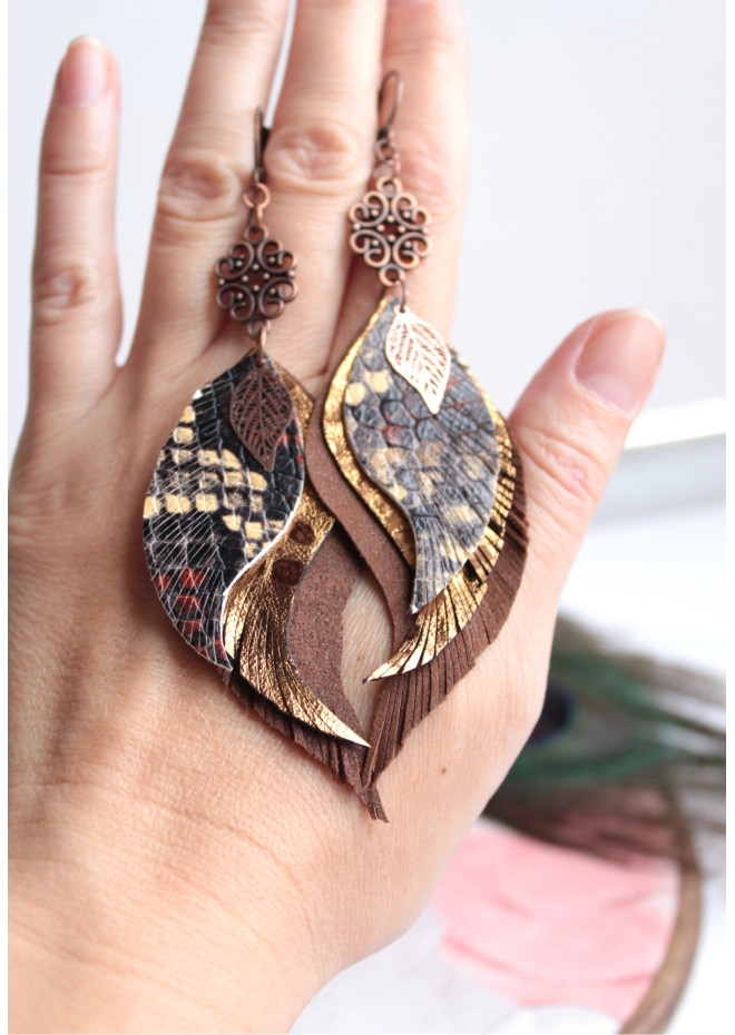 Unique high quality hand cut genuine leather feather earrings.
