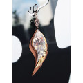 Unique high quality hand cut genuine leather feather earrings.
