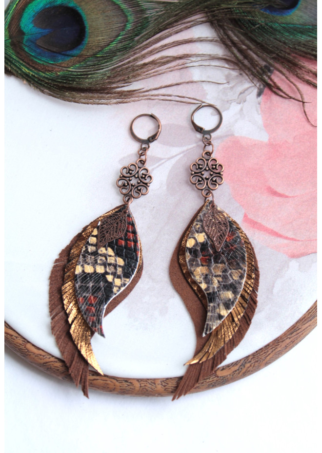 Unique high quality hand cut genuine leather feather earrings.
