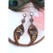 Unique high quality hand cut genuine leather feather earrings.