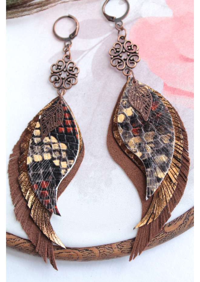 Unique high quality hand cut genuine leather feather earrings.