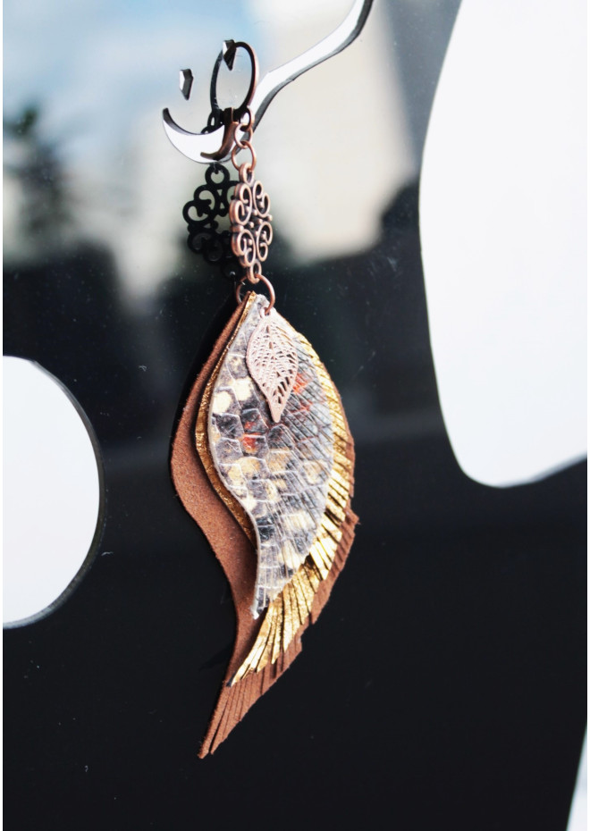 Unique high quality hand cut genuine leather feather earrings.