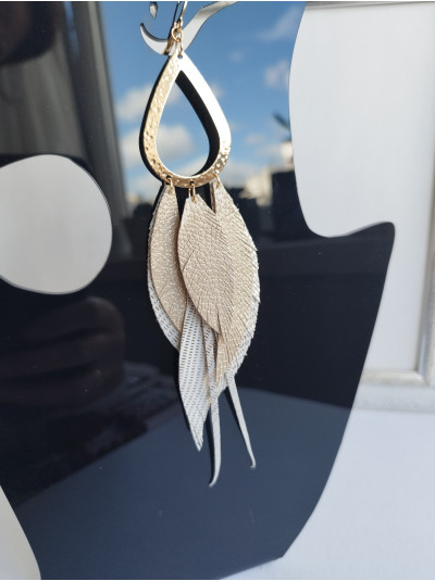beige antique gold extra long leather feather earrings.