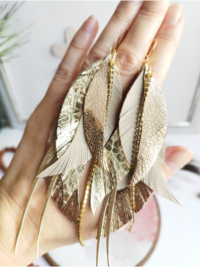 Beige gold leather feather earrings.  