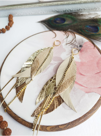Beige gold leather feather earrings.  