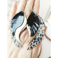 Black gold leopard print leather wings earrings.